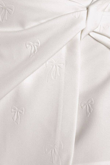 Bow embossed woven white skort