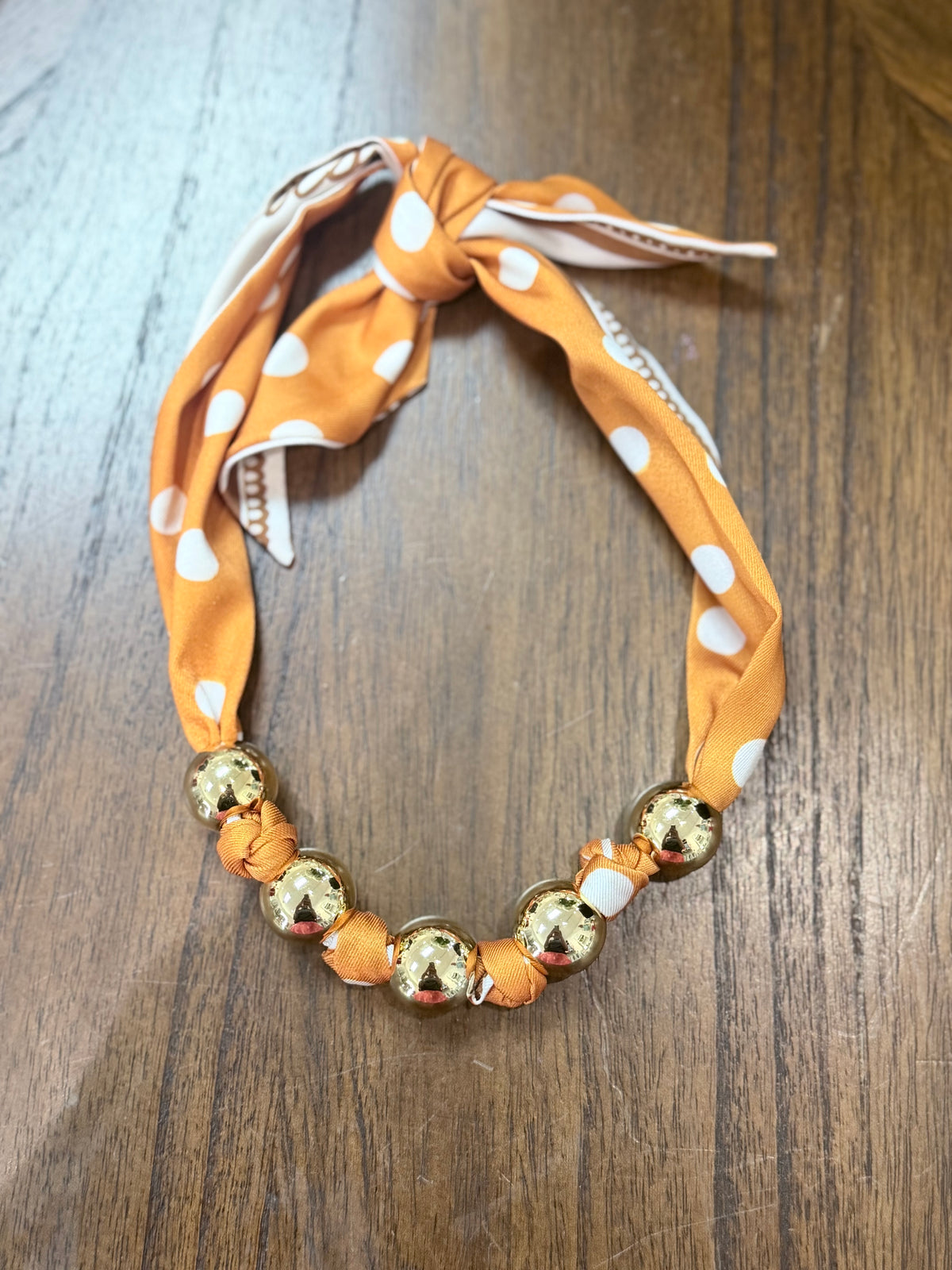 Orange polkadot scarf necklace with gold ball charms